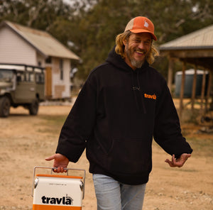 Travis Fimmel wearing travla monogram flexfit mesh snapback-orange